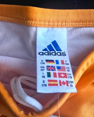 Bañador slip Adidas vintage naranja y azul