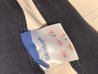 Reebok Pantalón de chándal beige con rayas