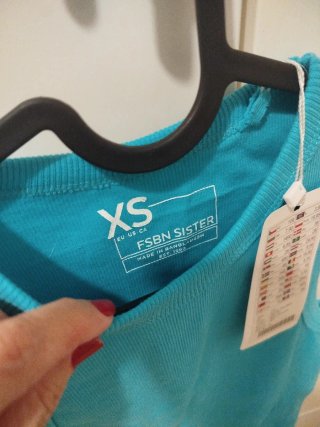 Top sin mangas turquesa talla XS