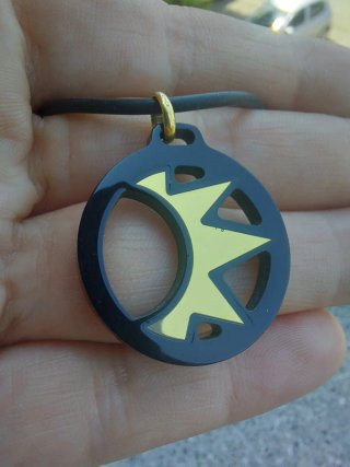 Ciondolo oro giallo 750 nero e oro