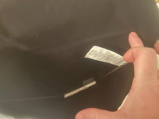 Cartera de mano bordada con flecos