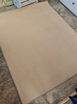Alfombra beige con estrellas grises