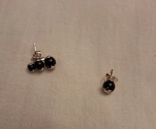 Pendientes Tous negros con estrella plateada