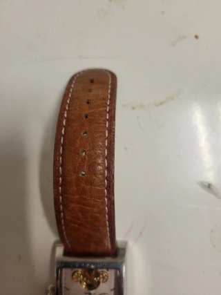 Reloj Marrón y Plateado