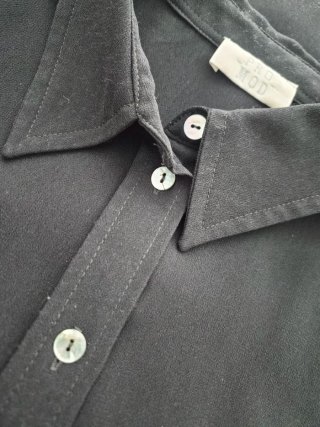 Blusa negra manga corta semitransparente