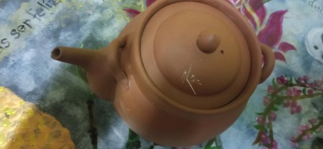Tetera de barro terracota con infusor