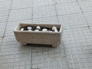 4 Jardineras de piedra beige y gris