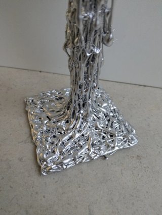 Candelabro efecto metal plateado