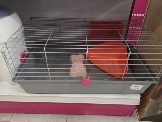 Jaula para mascotas gris y rosa