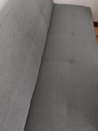 Sofá cama gris de tela
