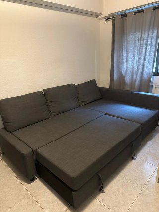 Sofá cama chaiselong gris con arcón