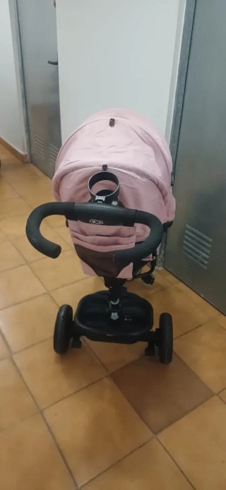 Triciclo infantil rosa con capota