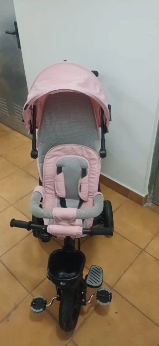 Triciclo infantil rosa con capota