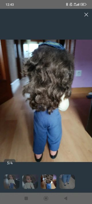 Muñeca antigua con traje de aviador