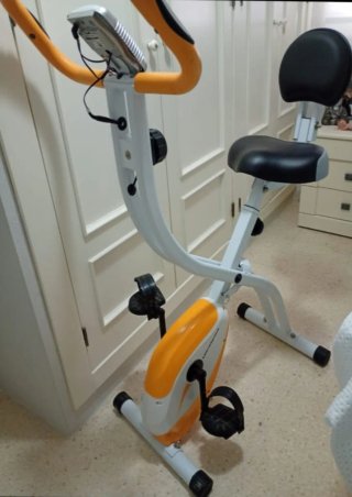 Bicicleta Estática Naranja y Blanca