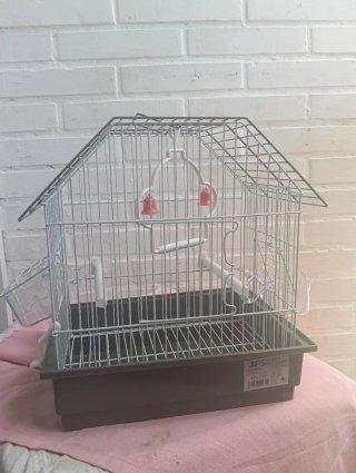Jaula para pájaros con accesorios
