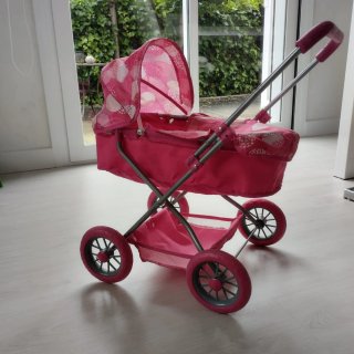 Cochecito de muñecas rosa
