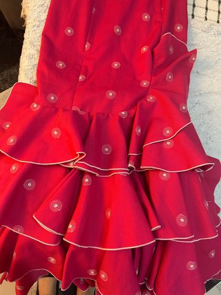Traje de flamenca rosa con volantes