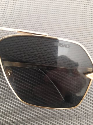 Gafas de sol Versace negras y doradas