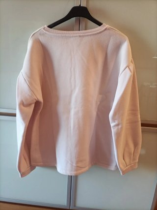 Sudadera rosa con pompón