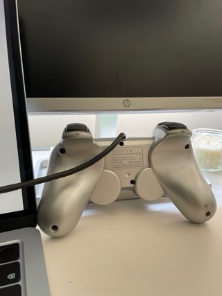 Mando PS2 Sony Plateado en perfecto estado
