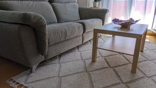 Sofá de tela gris para salón