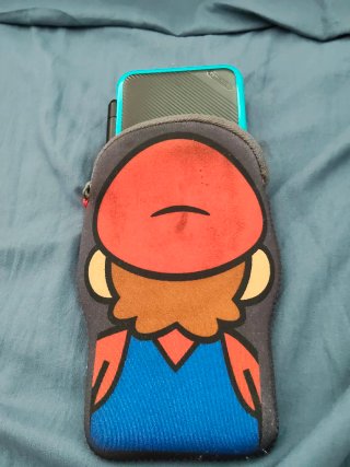 New Nintendo 2DS XL + funda + juegos