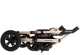 Carro de bebé negro y cobre