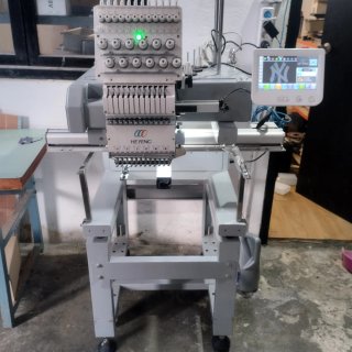 Maquina de bordar he Feng