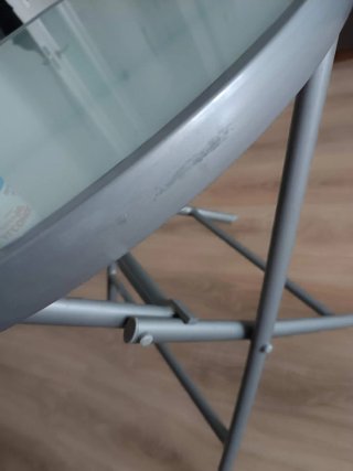 Mesa plegable cristal y metal gris. Diámetro 70 cm