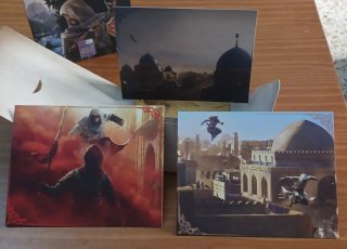 ASSASSINS CREED MIRAGE POSTALES Y MAPA DE BAGDAD