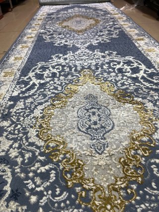 Alfombra azul y dorada poliéster
