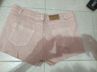 Pantalón corto rosa desgastado
