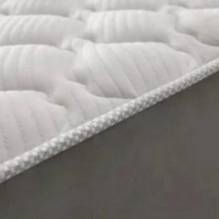 Cama tapizada con colchón