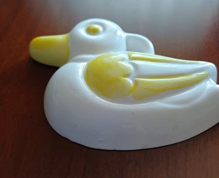 Decorazione da parete a forma di anatra