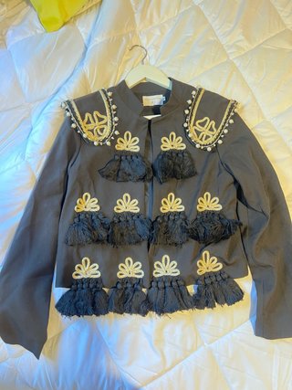 Chaqueta flamenca negra con detalles dorados