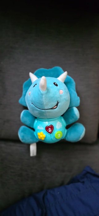 Dino musical peluche