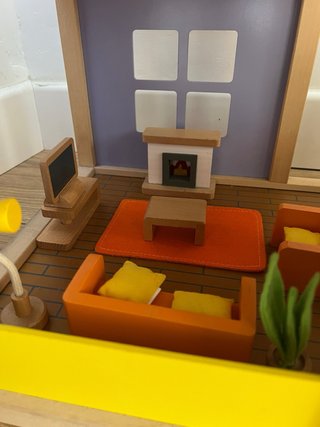 Casa de muñecas de madera Hape con muebles