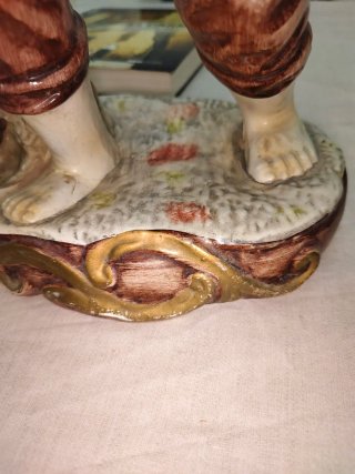 Estatua terracota pescador con cesta