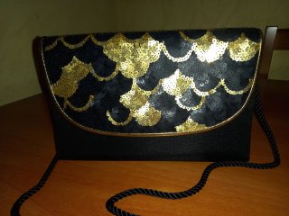 Bolso de fiesta negro y dorado