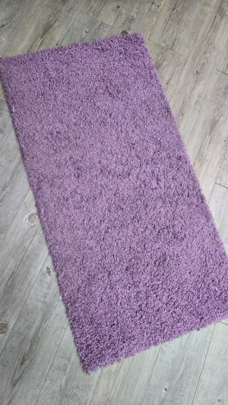 Alfombra púrpura de tela
