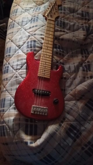 Guitarra eléctrica rojo brillante