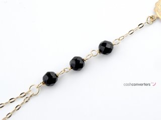 manita oro 18k con piedra con onix