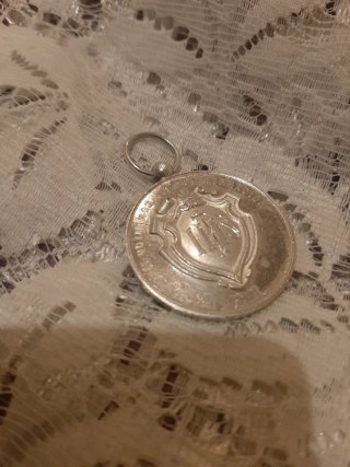 Medalla  recuerdo de mi Primera Comunión .Plata.