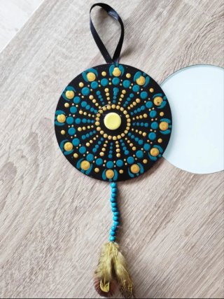 Atrapasueños decorativo con pluma