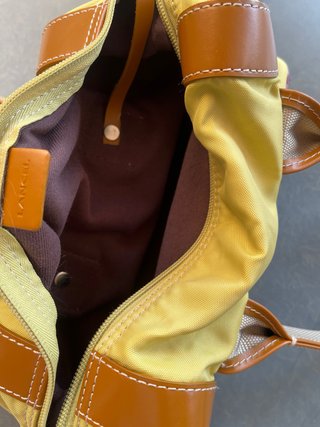 Bolso de mano y monedero Lancel amarillo