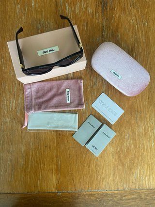 Occhiali da sole Miu Miu MU 11WS neri Donna