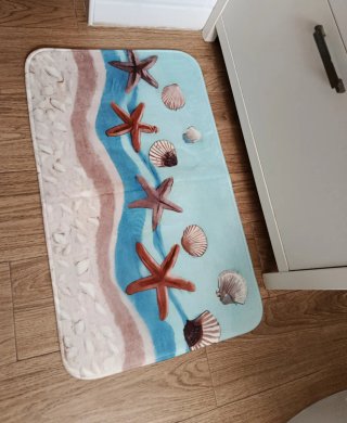 Tappeto da bagno con stelle marine e conchiglie