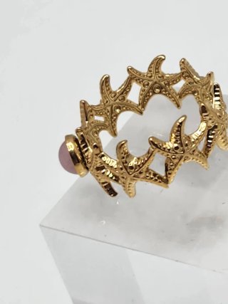Anillo ajustable acero dorado con piedra rosa