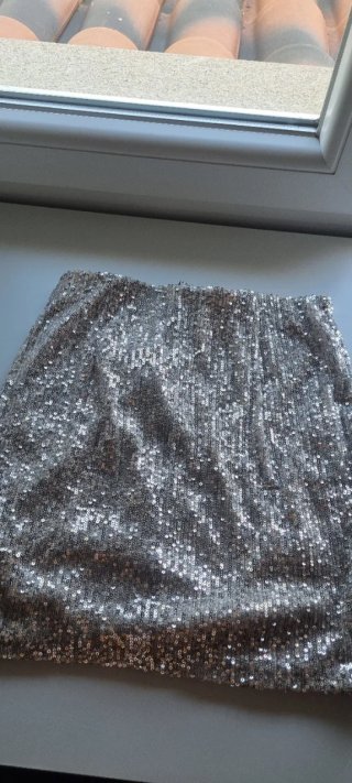 Minifalda lentejuelas dorada nudo cruzado